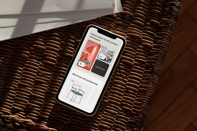 Handy mit New Architonic auf Beistelltisch
