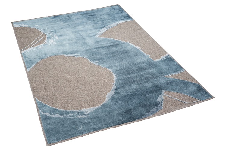 Freistellerbild von einem blauen Teppich mit einem grauen Kreis und drei Halbkreise, die am Rand abgeschnitten sind.